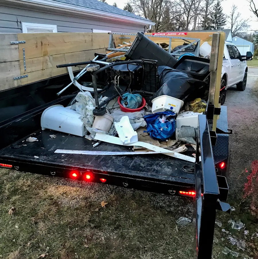 Roll-off dumpster delivered to a residential driveway in North Miami